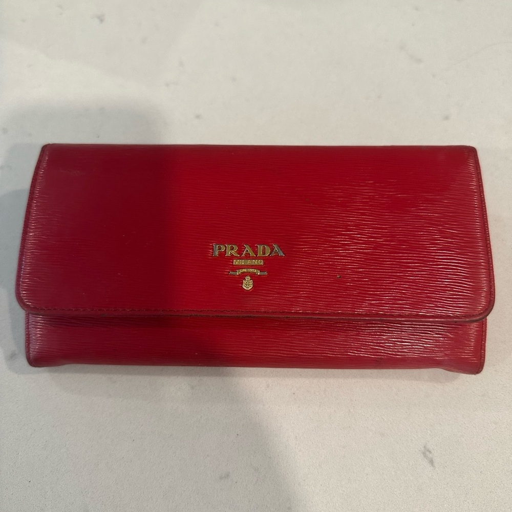 Prada red envelope leather wallet automatic.